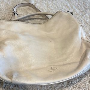 Light pink used Kate spade bag. Sold as is. Scuff mark